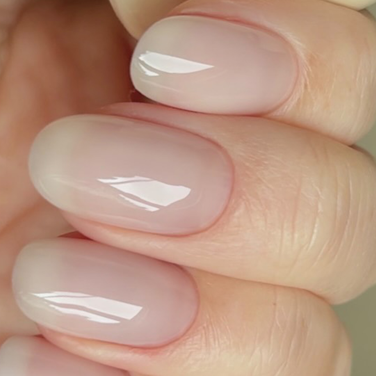 A close up of vanilla gloss nails