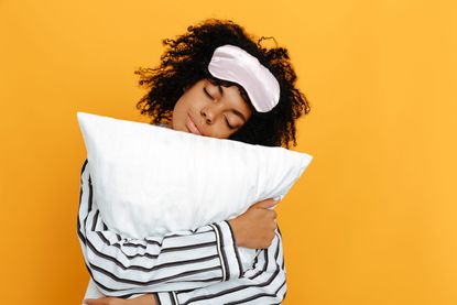 woman holding pillow