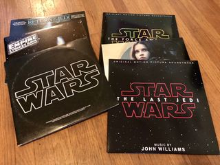 Star Wars vinyl records on wooden floor