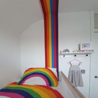 rainbow bedding with ladder out of a steel wardrobe hanging rail and some spare wood