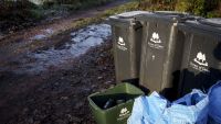 Recycling bins from the Forest of Dean County Council are located on a remote country lane in the Lower Wye Valley