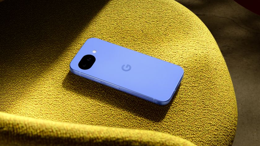 The Google Pixel 10a on a yellow surface.