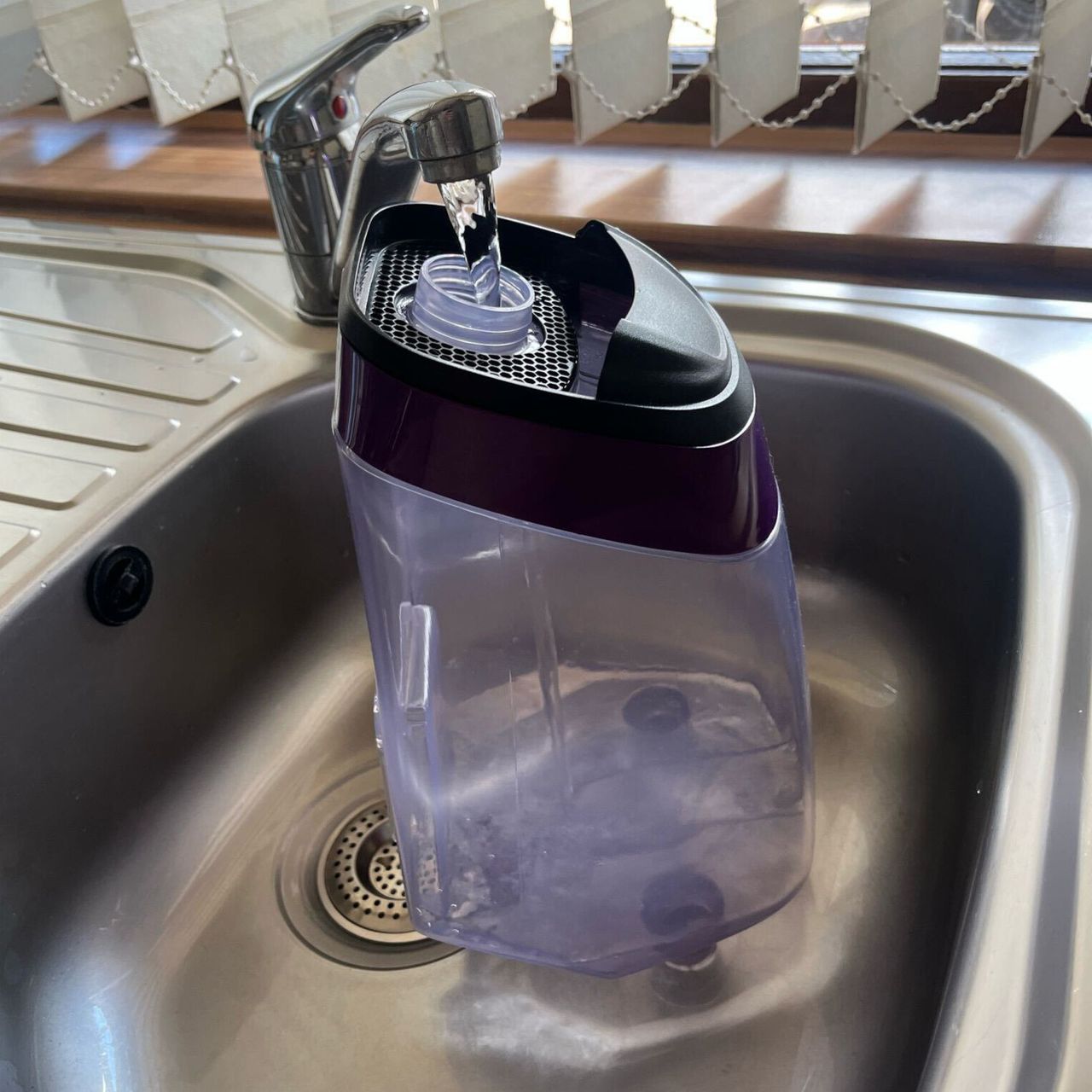filling the clean water tank of the bissell proheat 2x revolution pet pro