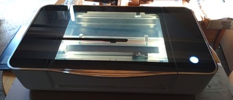 Glowforge Pro; a photo of a Glowforge laser cutter on a table