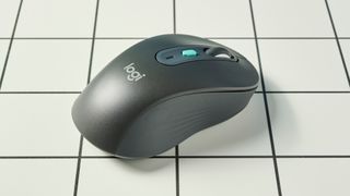 A black Logitech Signature AI Edition M750 wireless mouse