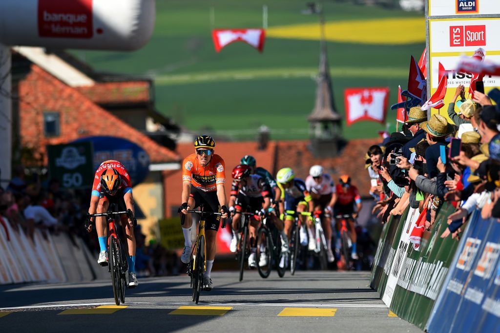 ROMONT SWITZERLAND APRIL 27 LR Dylan Teuns of Belgium and Team Bahrain Victorious sprints to beat Rohan Dennis of Australia and Team Jumbo Visma orange points jersey during the 75th Tour De Romandie 2022 Stage 1 a 178km stage from La Grande Beroche to Romont 777m TDR2022 on April 27 2022 in Romont Switzerland Photo by Dario BelingheriGetty Images