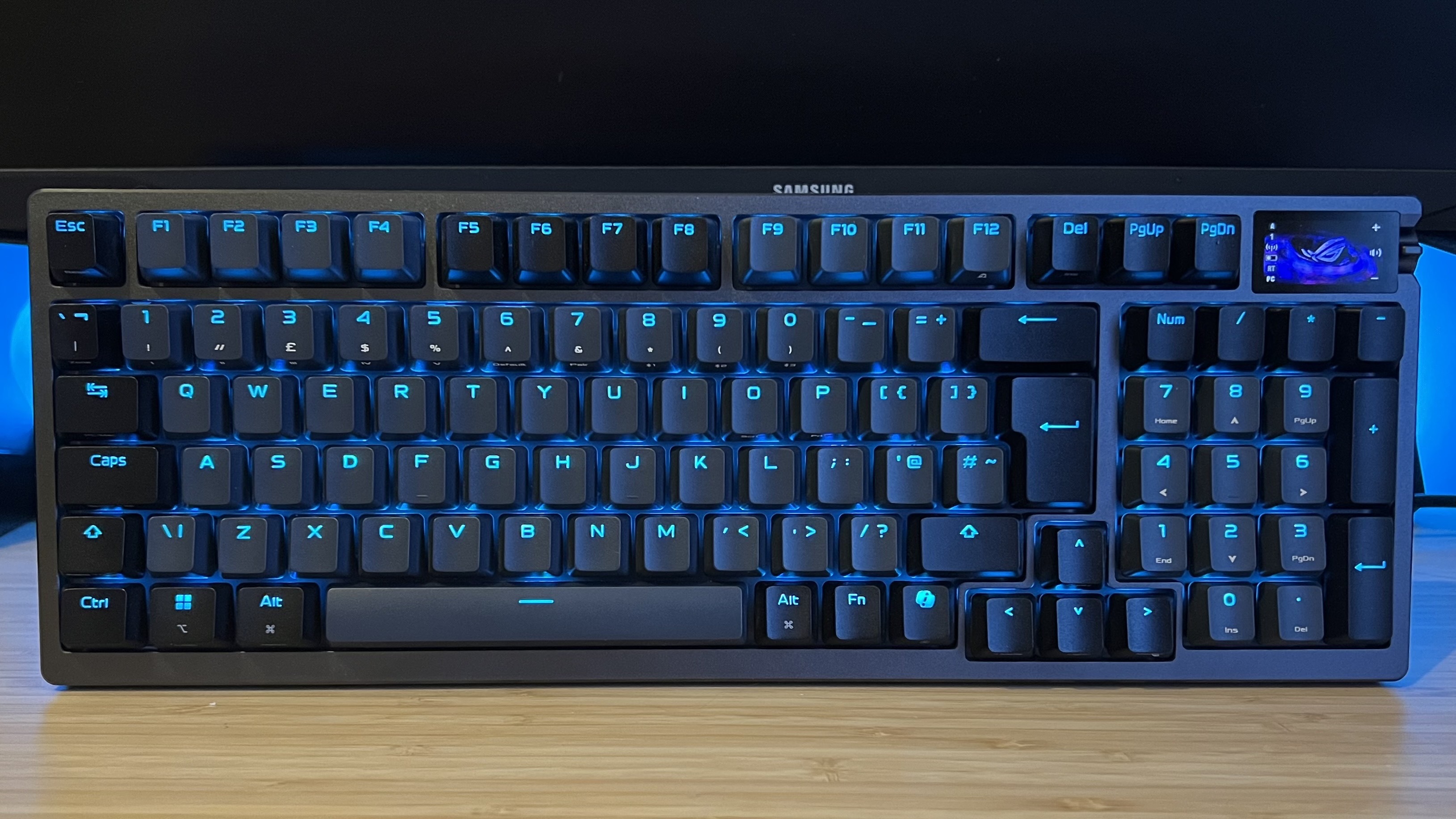 Asus ROG Azoth 96 HE standing up on a wooden desk