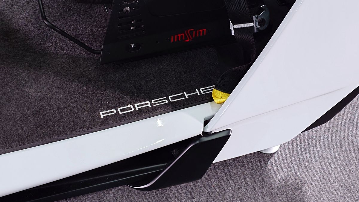 Closeup photo of the ImSim Porsche Raceborn simulator showing the Porsche logo