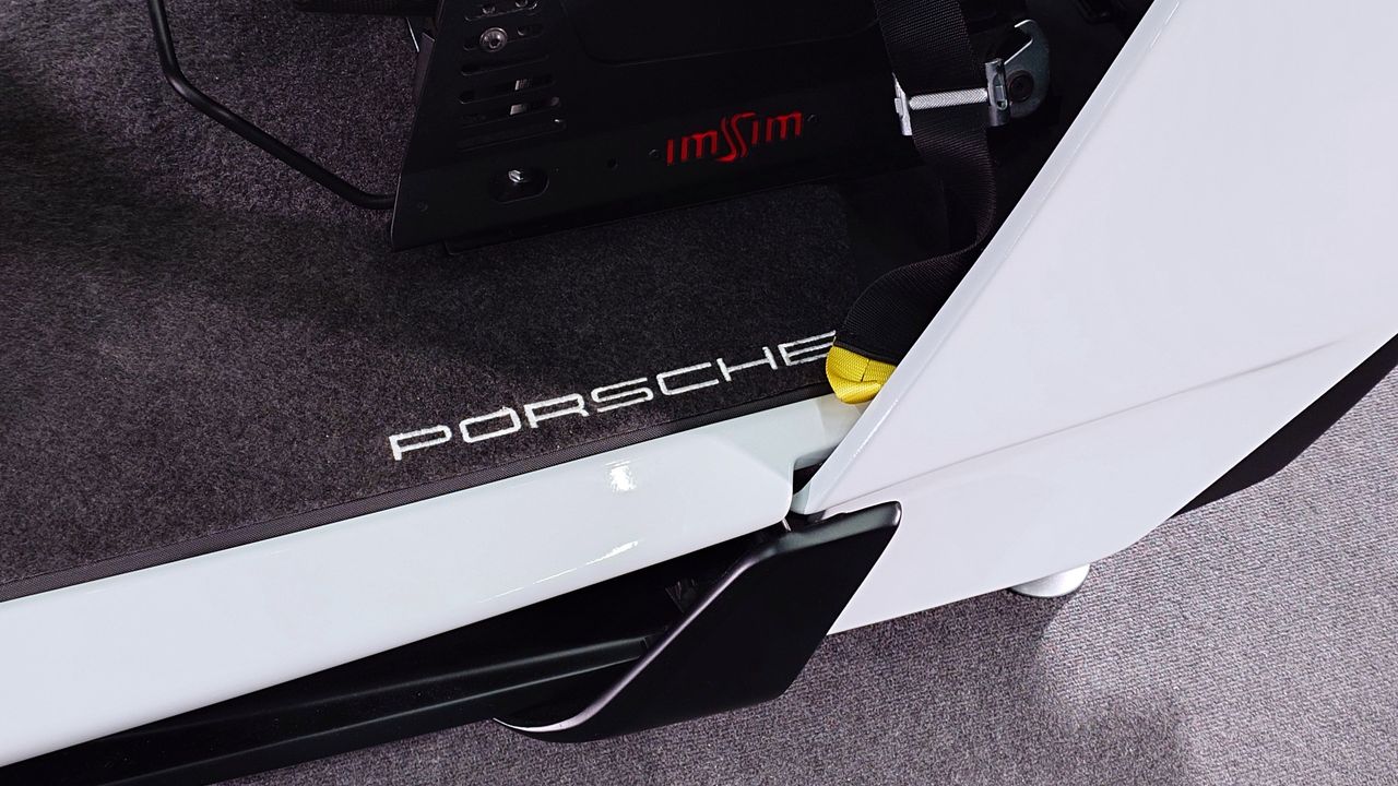 Closeup photo of the ImSim Porsche Raceborn simulator showing the Porsche logo