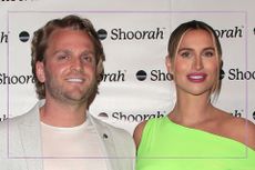 Ferne McCann in bright green dress stood with husnad