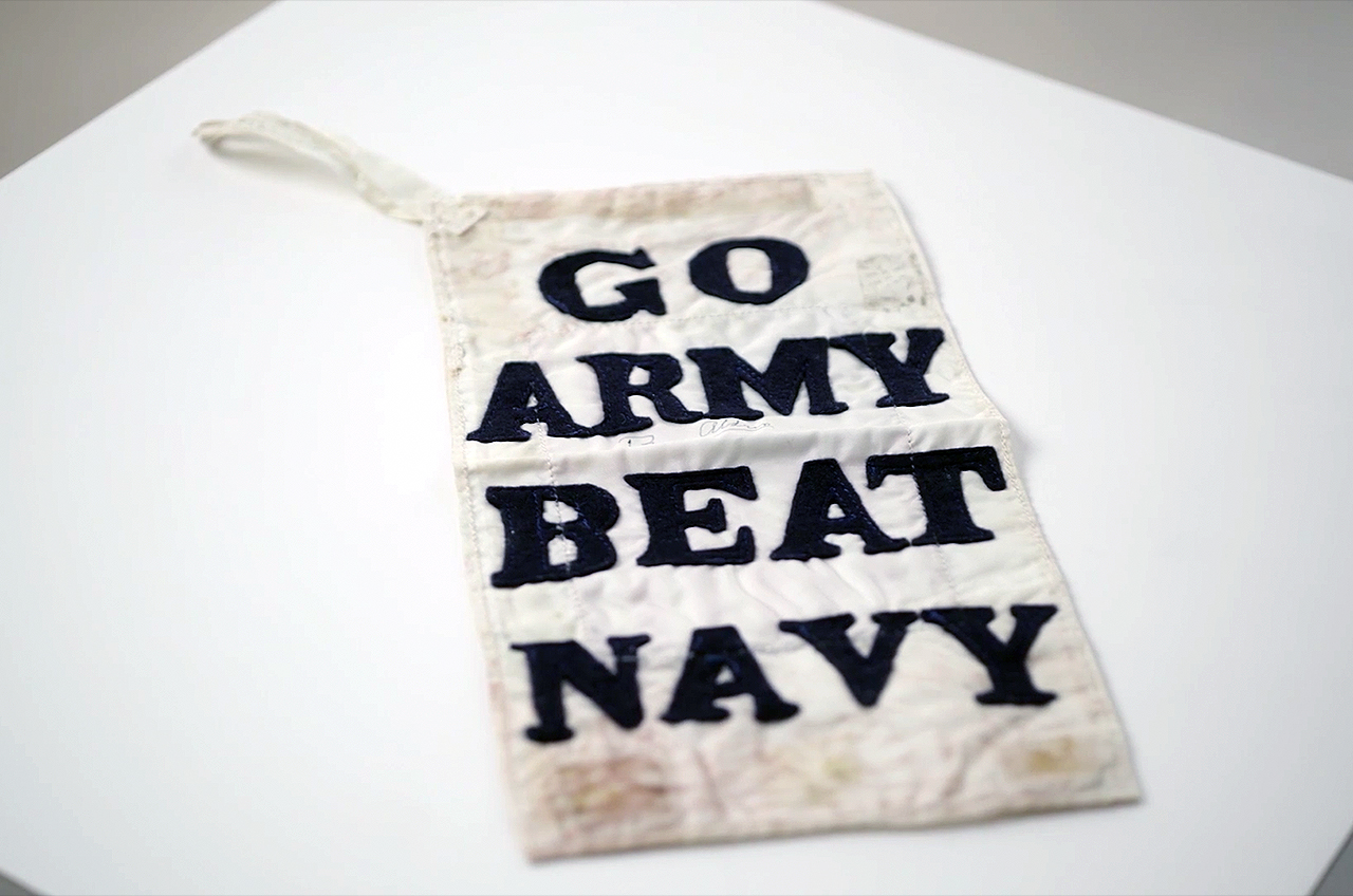 Buzz Aldrin's "Go Army, Beat Navy" cloth banner that he displayed during a spacewalk on Gemini 12 is expected to sell at the "Buzz Aldrin: American Icon" auction for $20,000 to $30,000.