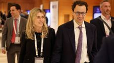 Cami Clark walks alongside her husband, Anthropic CEO Dario Amodei.