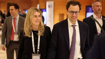 Cami Clark walks alongside her husband, Anthropic CEO Dario Amodei.