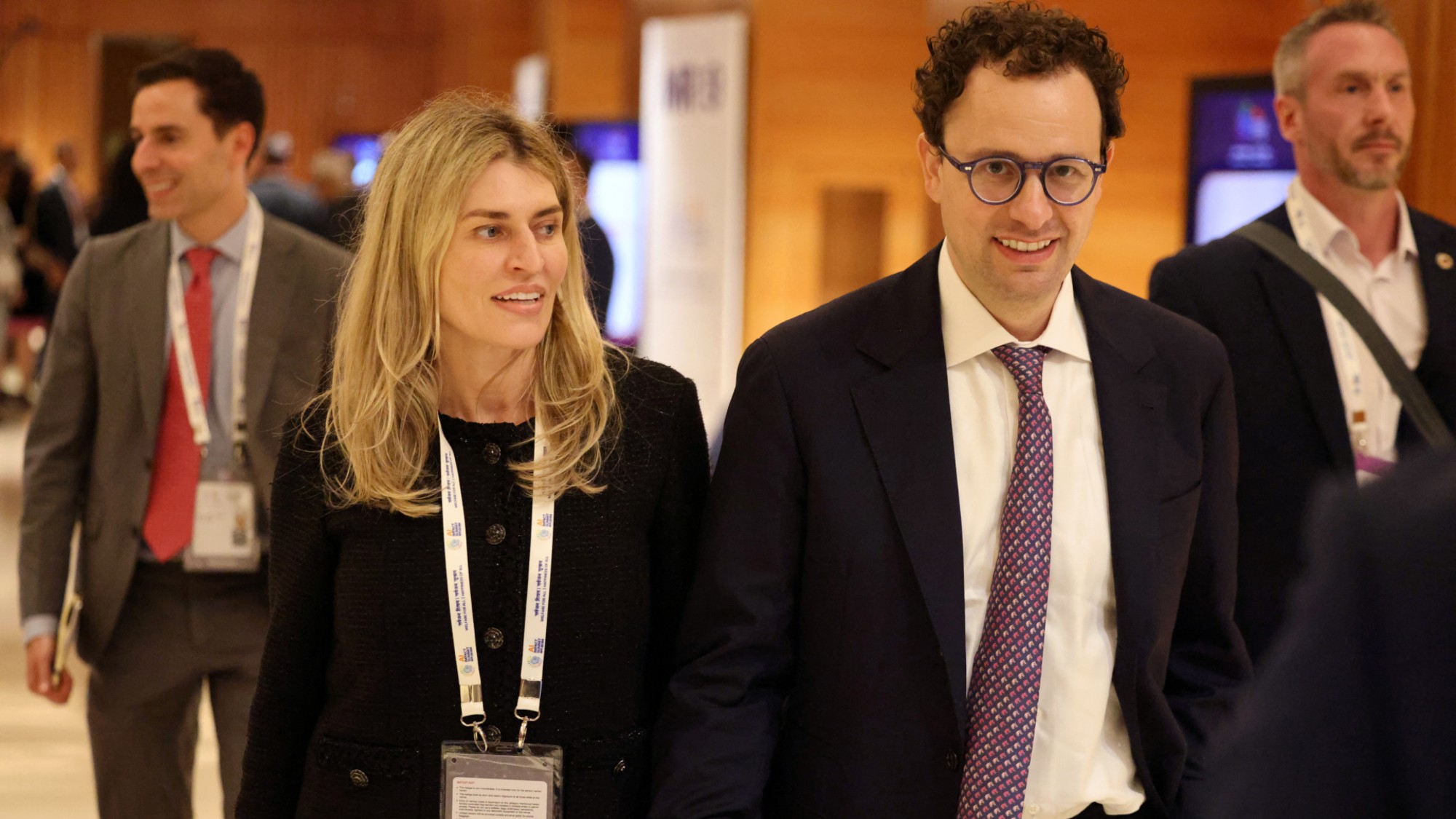 Cami Clark walks alongside her husband, Anthropic CEO Dario Amodei.