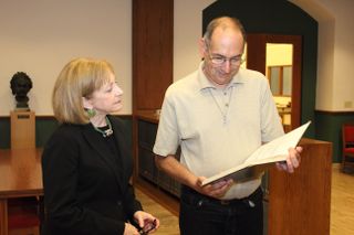 David Levy ceremonially presented 25 of his observation logs to Linda Hall Library's president, Lisa Browar, on Sept. 10, 2015.