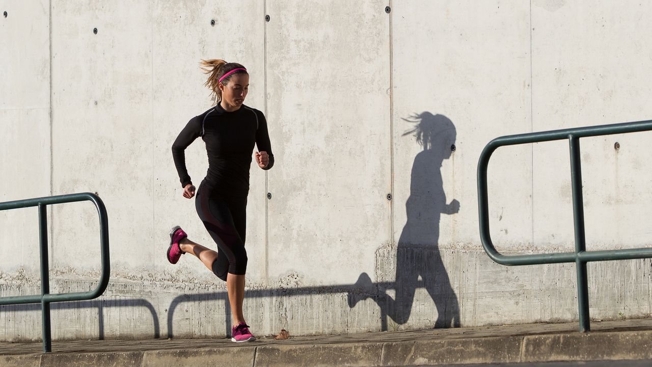 Woman running uphill