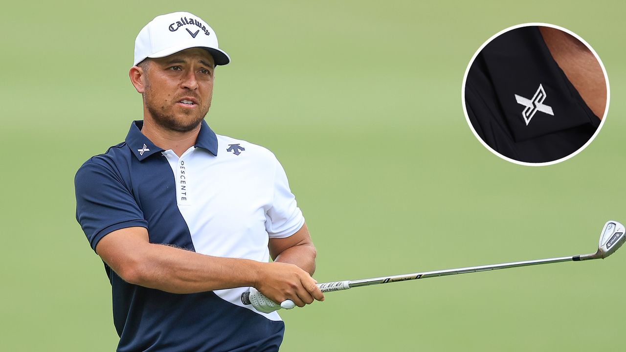 Xander Schauffele hits an iron shot