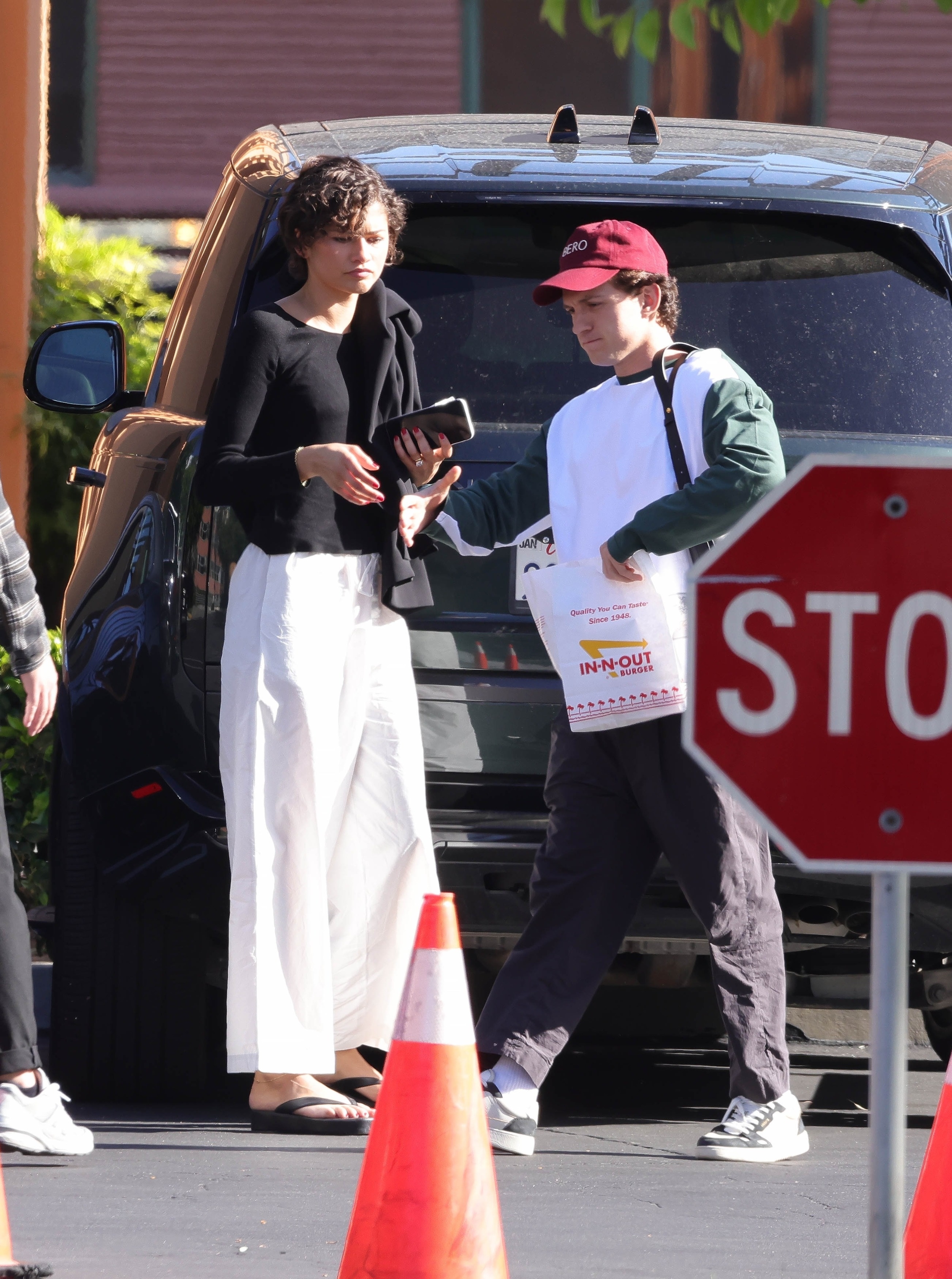 Zendaya wore a black-and-white off-duty outfit with platform The Row flip flops