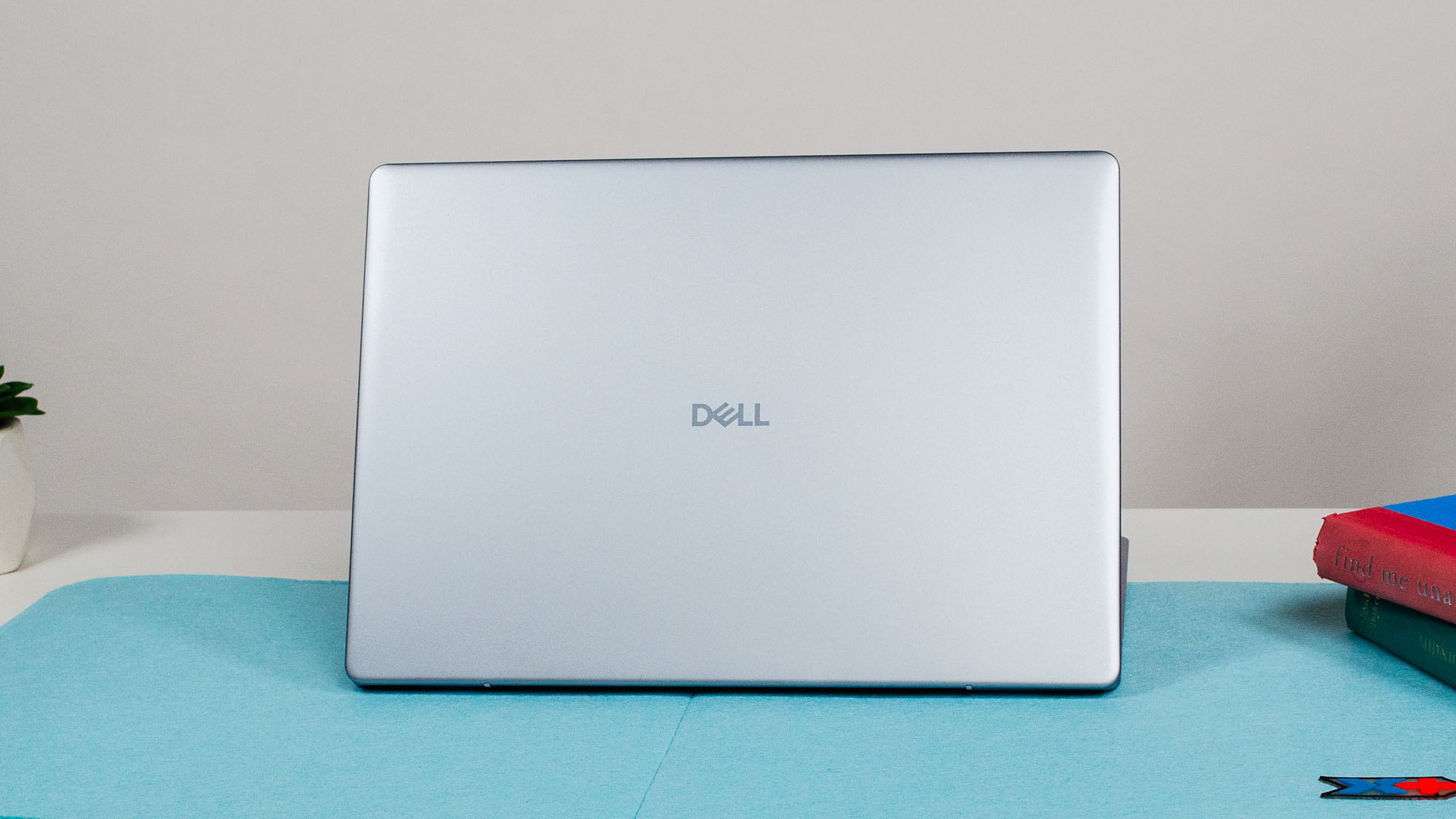 A Dell 16 Plus on a desk with its lid facing out