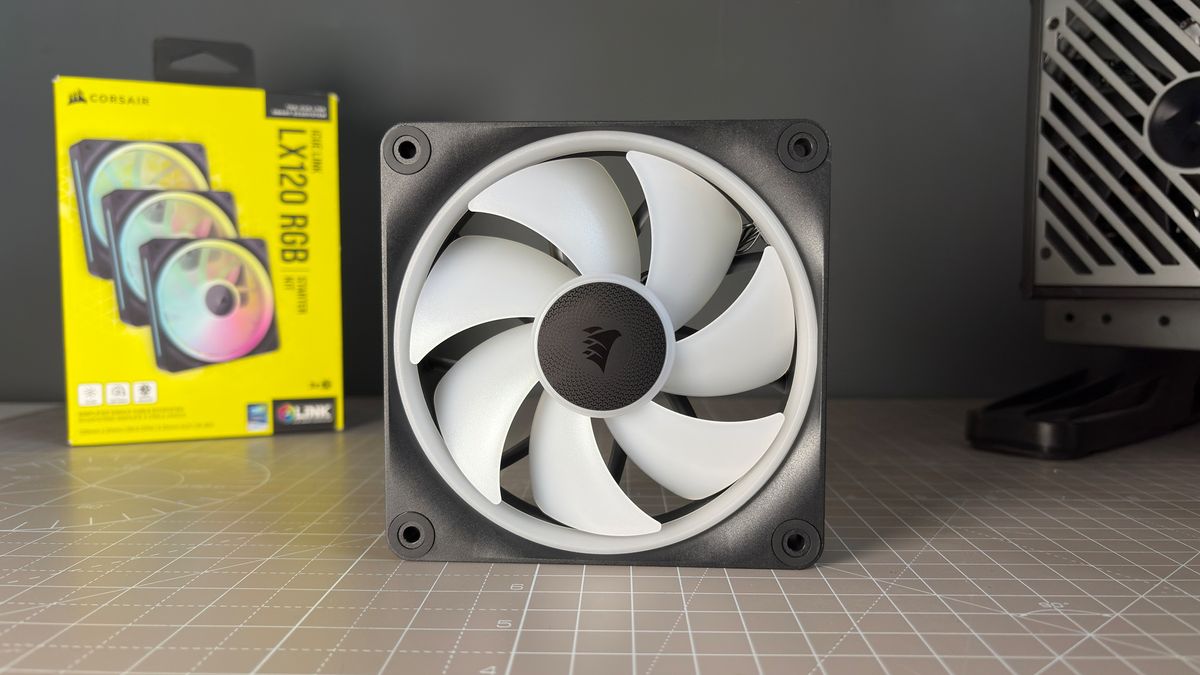 Various PC fans on a table with testing equipment for a round of batch tests.