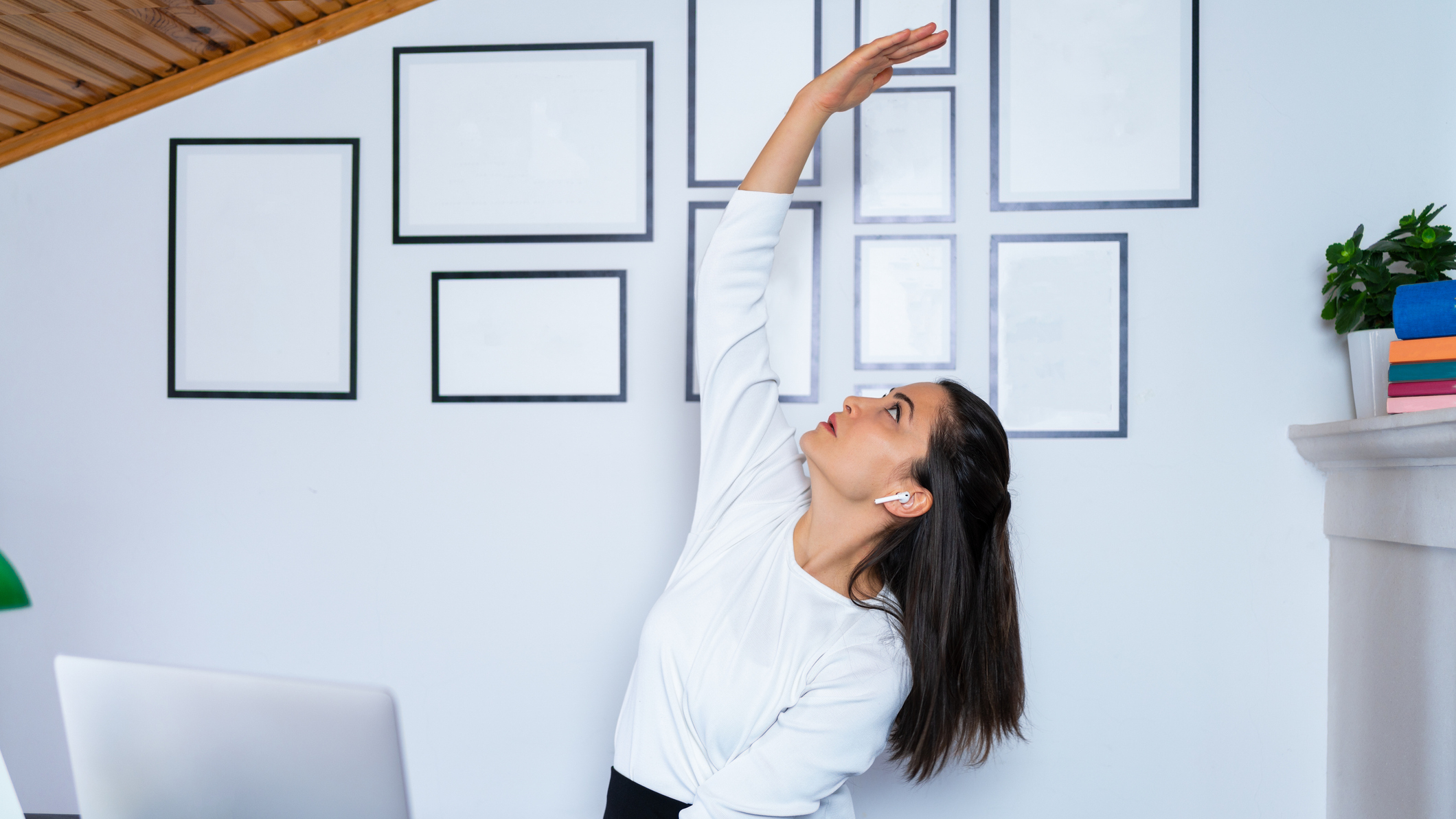 Woman stretching in office environment