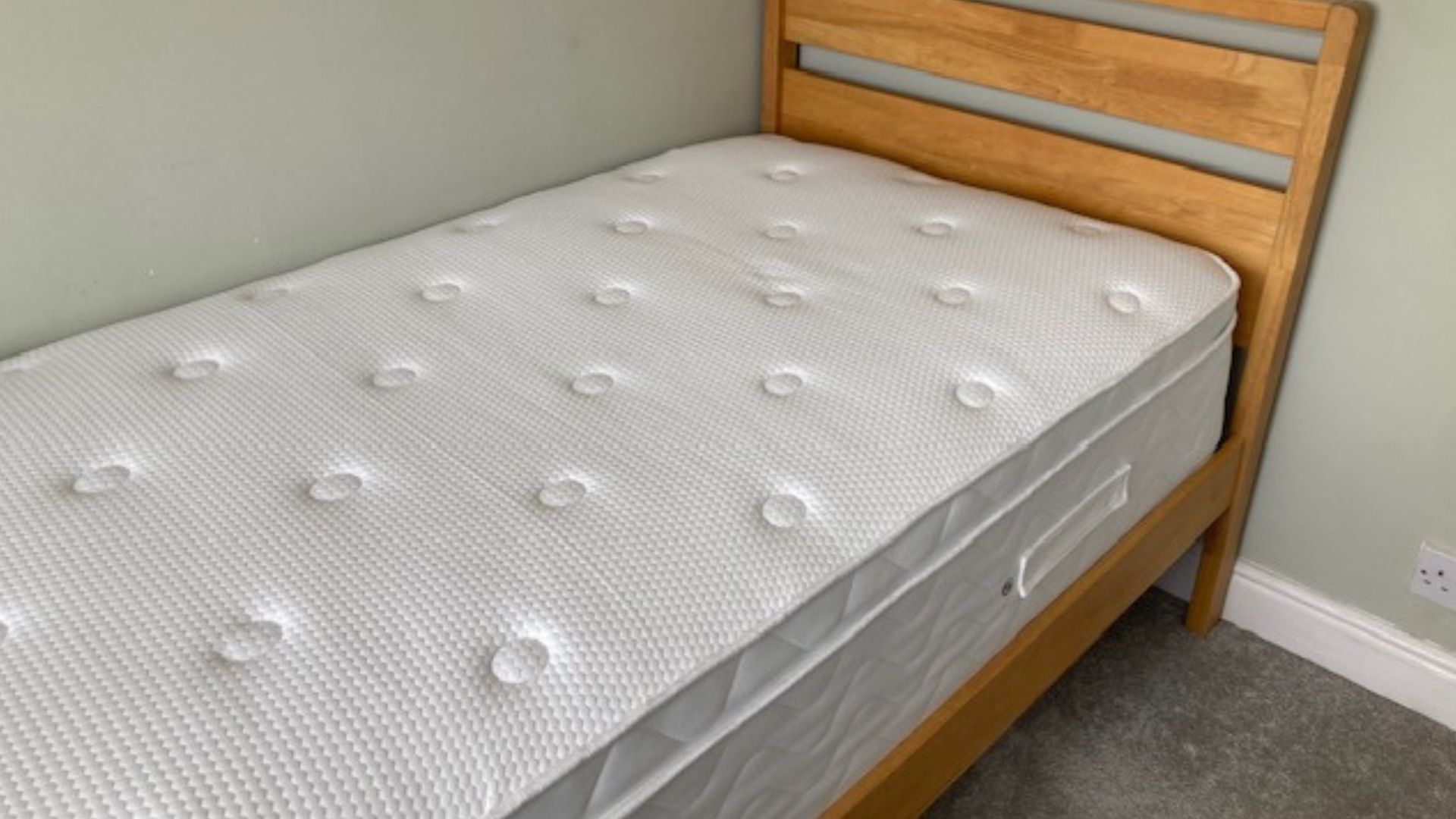 Evermore 1500 Pocket Spring Foam Hybrid Mattress in our tester, Linda's bedroom on a wooden bed frame