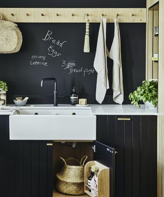 chalkboard wall above belfast sink