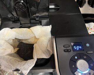 Drip filter coffee being prepared using a filter and ground coffee in Keurig K-Duo single-serve and carafe coffee maker