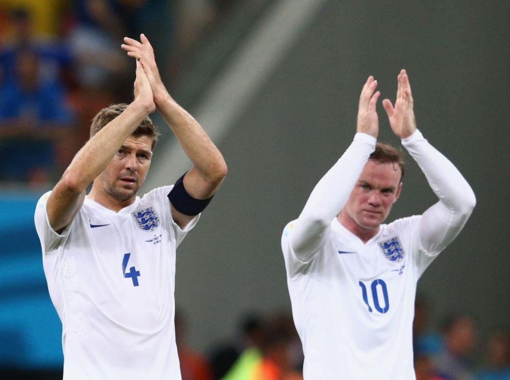 Wayne Rooney and Steven Gerrard applaud England fans