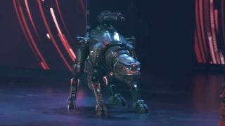 Killer robot dog on presentation stage ready to attack on NCIS: Tony & Ziva