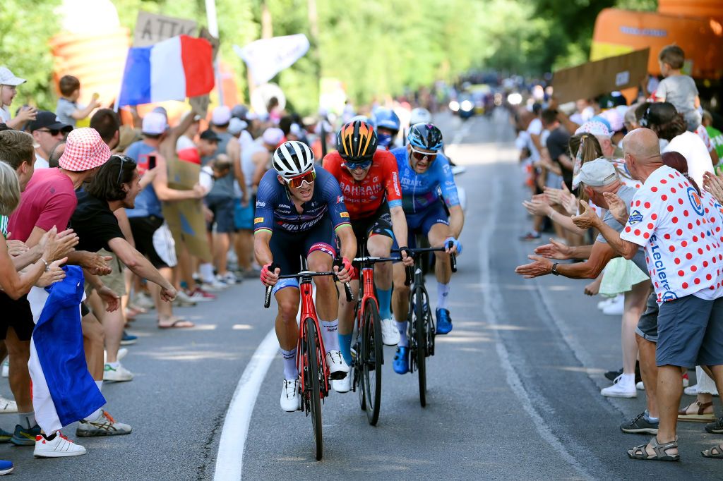 SAINTETIENNE FRANCE JULY 15 LR Mads Pedersen of Denmark and Team Trek Segafredo Fred Wright of United Kingdom and Team Bahrain Victorious and Hugo Houle of Canada and Team Israel Premier Tech compete in the breakaway while fans cheer during the 109th Tour de France 2022 Stage 13 a 1926km stage from Le Bourg dOisans to SaintEtienne 488m TDF2022 WorldTour on July 15 2022 in SaintEtienne France Photo by Alex BroadwayGetty Images