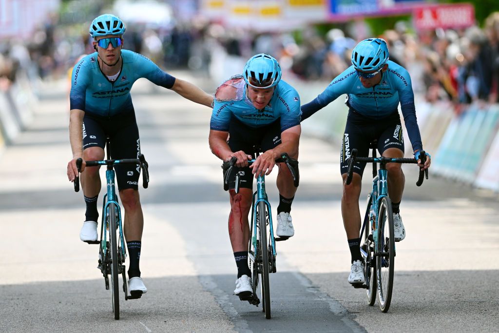 DUNKERQUE FRANCE MAY 16 LR Cees Bol of The Netherlands Gleb Syritsa of Rusia crashed and Yuriy Natarov of Kazakhstan and Team AstanaQazaqstan cross the finish line during the 67th 4 Jours de Dunkerque Grand Prix des Hauts de France 2023 Stage 1 a 1966km at stage from Dunkerque to Abbeville on May 16 2023 in Dunkerque France Photo by Luc ClaessenGetty Images