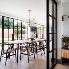 Dining area in extended property with Crittall-style doors to the patio