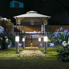 garden with bar and metal lantern hanging