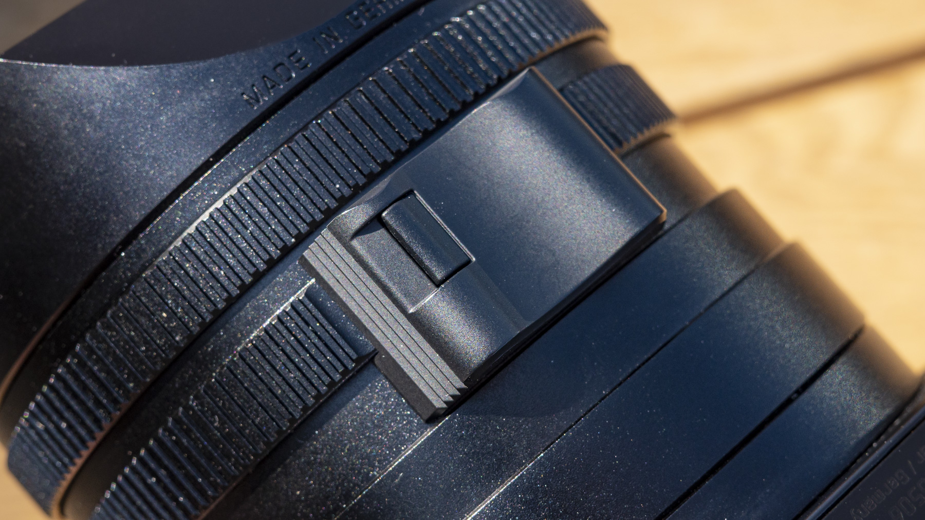 Leica Q3 camera closeup of lens focus ring