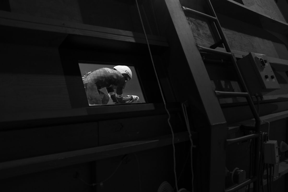 A view from outside the wind tunnel while a rider is tested.
