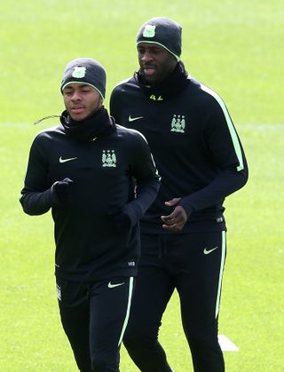 Yaya Toure (back) is fully behind Raheem Sterling (front).
