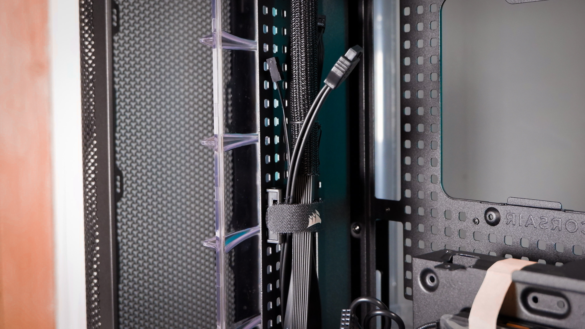 A Corsair Air 5400 PC case on a desk with various parts installed.