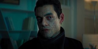 Rami Malek looks cooly to the side in No Time To Die.