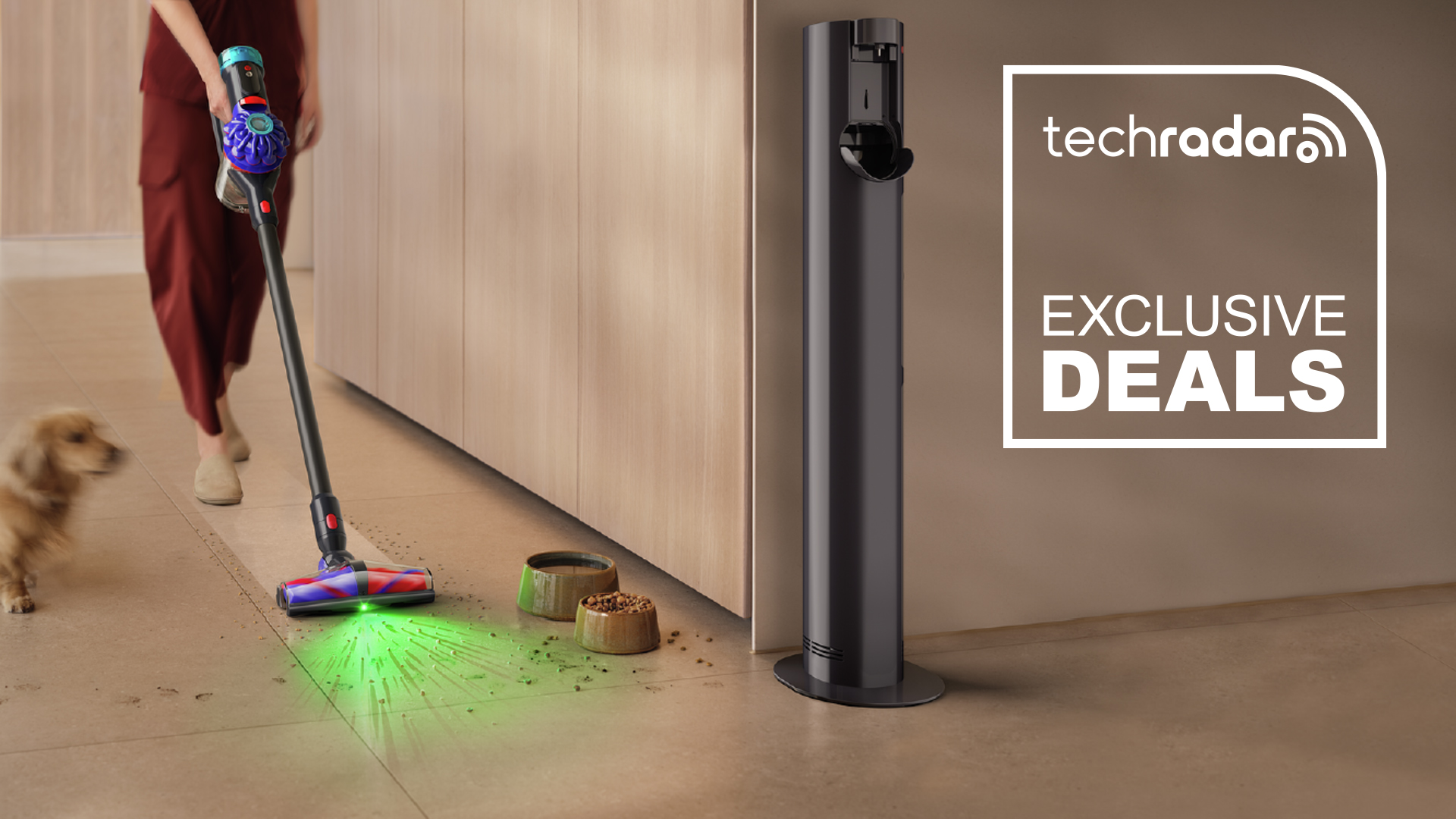 A woman using the Dyson V10 Konical vacuum to clean up spilt dog food in a kitchen. A TechRadar deal badge with "Exclusive Deals" text is on the right.