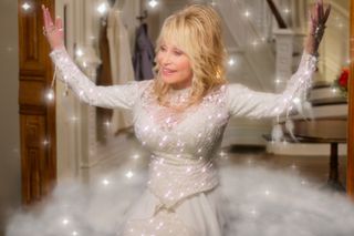 Dolly Parton wears a white sparkly top in 'Dolly Parton's Christmas on the Square'