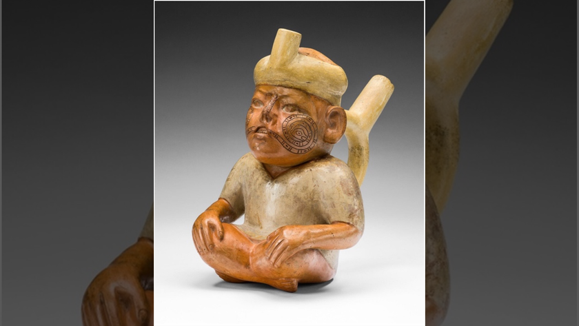 A ceramic vessel depicting a man with a cleft lip.