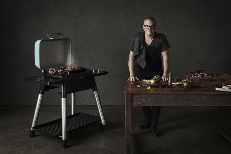 Everdure Force 2 BBQ with Heston Blumenthal working at nearby table
