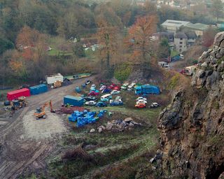 Car junk yard. The photo is taken from a higher ground.