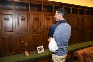 Rory McIlroy looks at his locker in the TPC Sawgrass champions' locker room