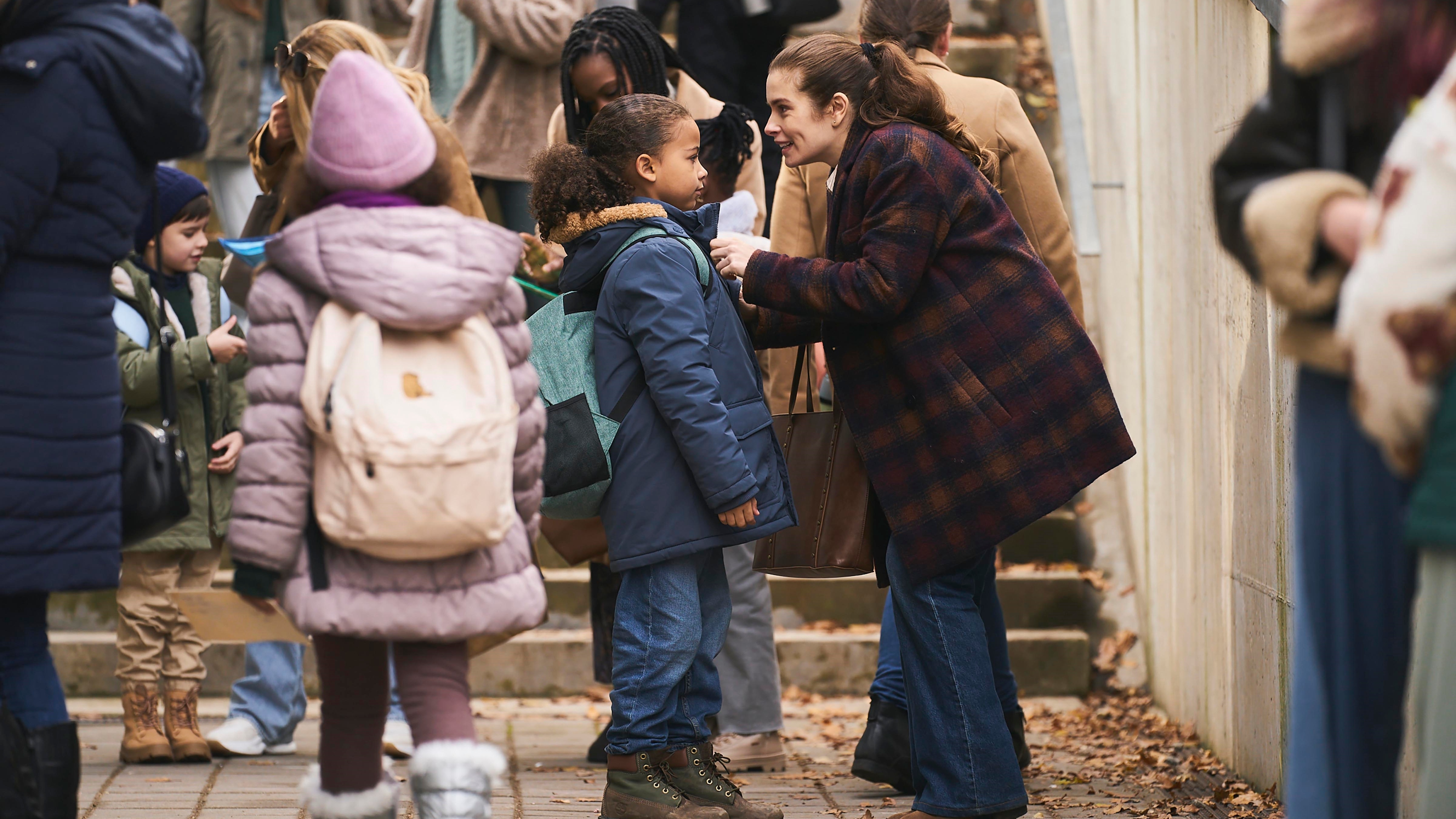 Joanna saying goodbye to her son at the school gates in The Rumour