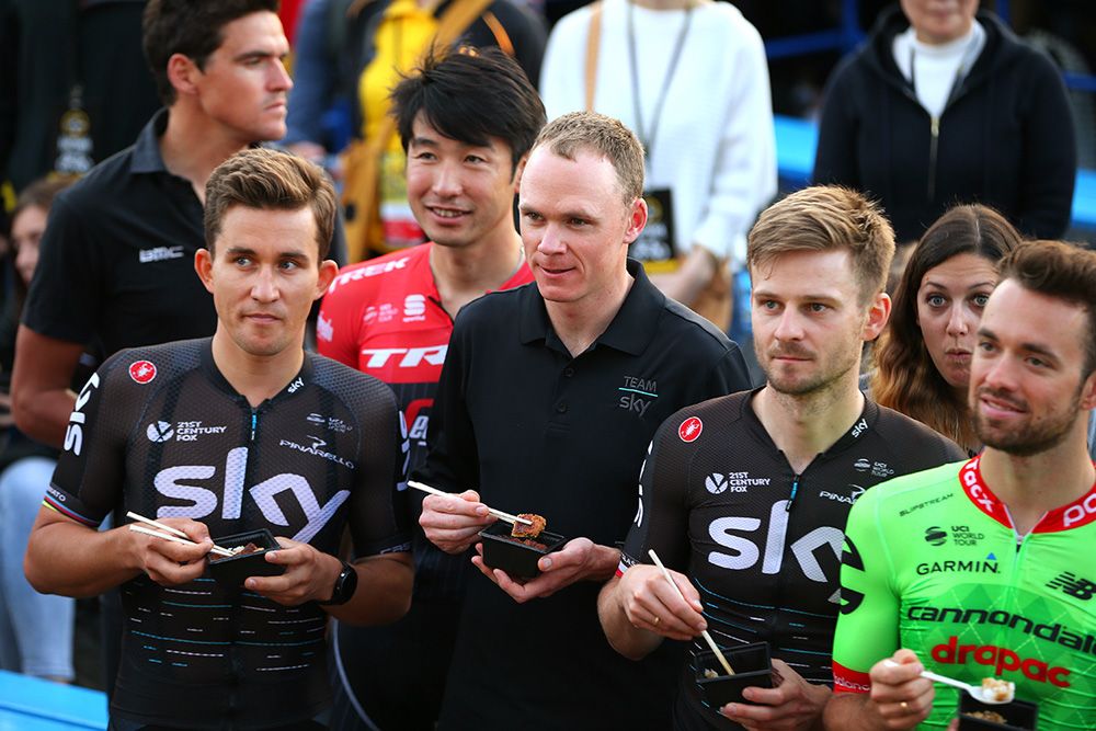 Chris Froome and his teammates eat some of the eel