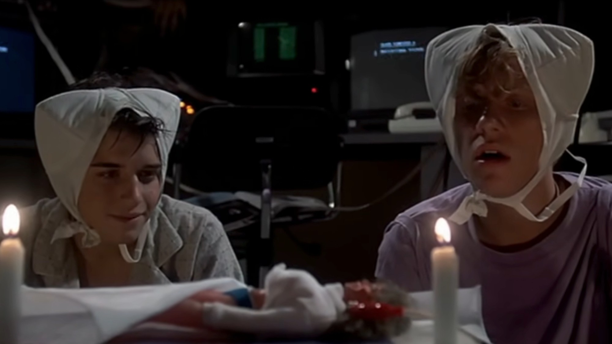 Ilan Mitchell-Smith and Anthony Michael Hall wearing bras on their heads in Weird Science