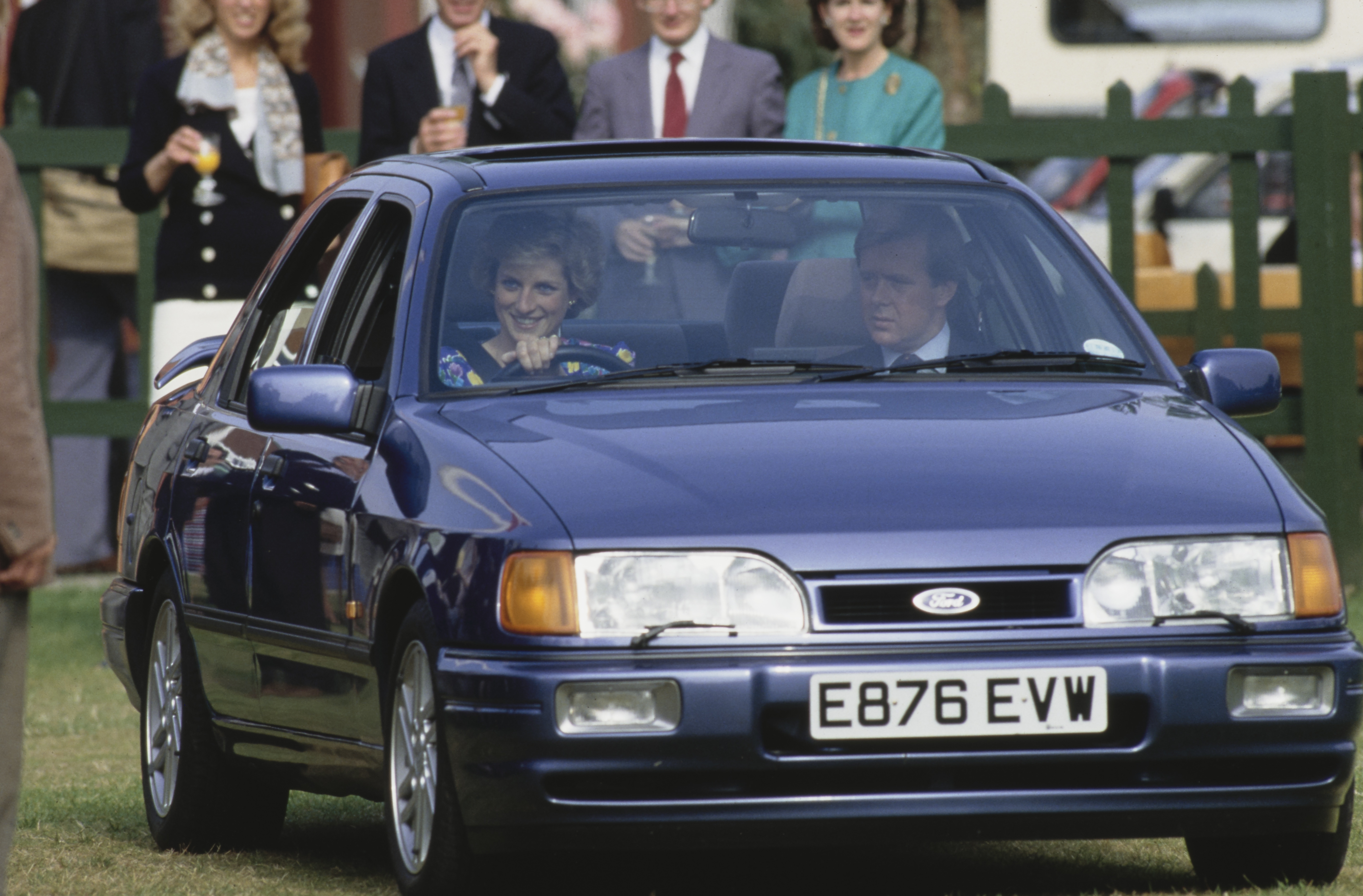 Princess Diana driving a car sitting next to bodyguard Ken Wharfe