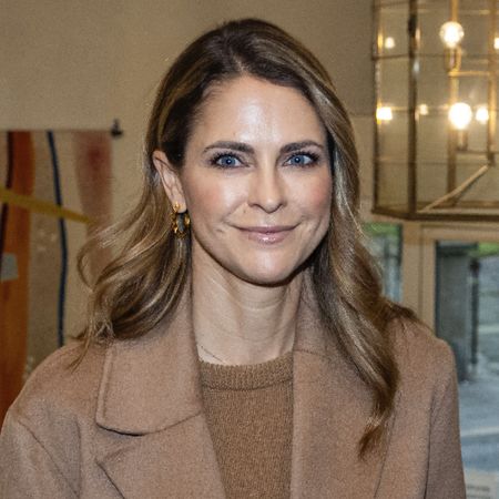 Princess Madeleine of Sweden wears a tan coat and brown top and shares a photo of her two daughters in scary Halloween outfits